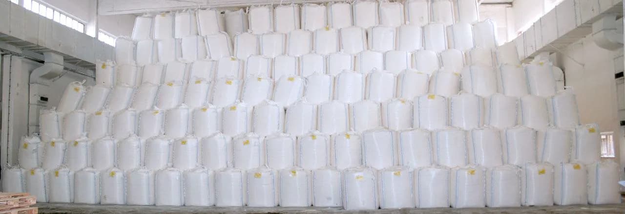 Rolls of woven polypropylene fabric in the DIV Trades weaving plant